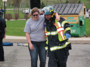 One of the crash survivors gets assistance at the scene.