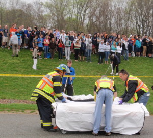 Workers from the Chester County Coroner's Office get ready to place one of the teens pronounced dead at the scene into a body bag.