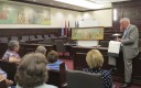 Chester County Court Judge Thomas G. Gavin discusses what little information is known about the 1956 mural   by Edward Shenton. Behind him is the model painting that differs in numerous small ways from the finished product.