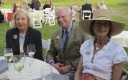 Marquerite (from left) and Gerry Lenfest take a few moments to sit on Saturday evening with Penny Watkins, a Natural Lands Trust board member.