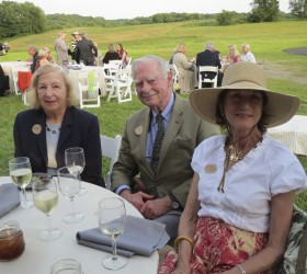 Marquerite (from left) and Gerry Lenfest take a few moments to sit on Saturday evening with Penny Watkins, a Natural Lands Trust board member.