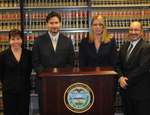 Newly promoted deputy district attorneys are Michelle Frei (from left), Mark Conte, Renee Merion, and Thomas Ost-Prisco.