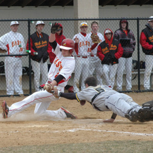 Ryan LAngerhans of Unionville makes a diving tag against West Chester East, Thursday. Photo courtesy Paul Langerhans.