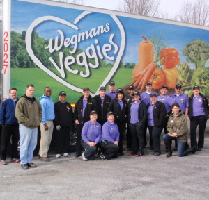 Wegmans employees pose with members of the Chester County Food Bank outside the loading dock.