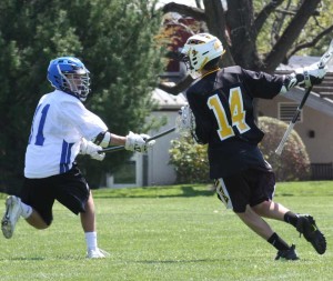 Kennett Middle School's Charlie Cordisco looks to stop Upland Country Day School's Bentley Ahl during this past weekend's Upland Invitational Lacrosse Tournament.