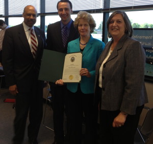 Ruth E. Kranz-Carl holds a certificate she received from Commissioner Terence Farrell (from left), Commissioners' Chairman Ryan Costello, and Commissioner Kathi Cozzone.