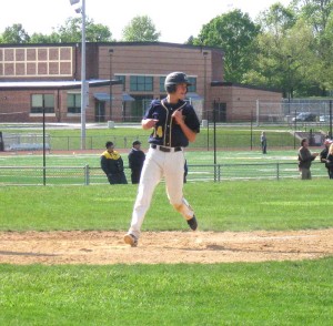 Second baseman Sean Faux trots in with Unionville's fifth run of the day