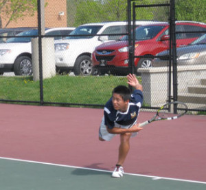Unionville High School's boys tennis team completed a fought straight perfect season in the Ches Mont, with a win over West Chester East, Tuesday. No. 1 singles player Johnny Wu follows through on a serve.