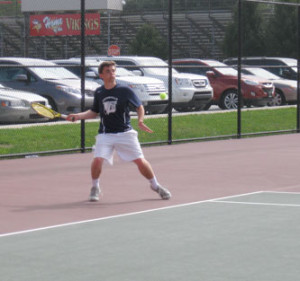 Unionville first doubles player and co-captain Jeremy Waterkotte smacks a forehand.