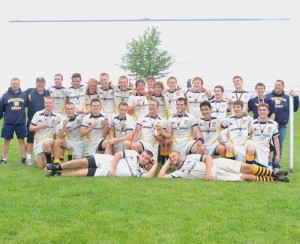 The Pennsylvania State Champion Unionville Rugby team poses with their trophy and medals after winning the title in thrilling fashion over St. Joseph's 21-14, Sunday.