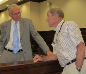 Chester County Court Senior Judge Thomas G. Gavin (left) chats with Ned Shenton, the son of the creator of a 1956 mural that now hangs in Courtroom Two of the Chester County Justice Center.