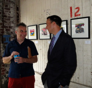 Artist Jeff Schaller (left) discusses his paintings with Chester County Commissioners’ Chairman Ryan Costello. Schaller said he enjoyed placing his artwork on walls that boasted their own adornments, such as the number 12.