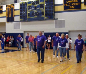 Cancer survivors are applauded by volunteers during the Kennett/Unionville Relay For Life, Saturday.