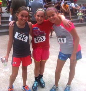 Three competitors enjoy a laugh following the 10th annual KAPRB kids race in Anson B. Nixon Park.