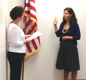 Leticia Flores DeWilde takes to oath of office from Unionville-Chadds Ford School Board President Eileen Bushelow, Monday night. Flores DeWilde replaces Frank Murphy and was appointed last month to serve through November.