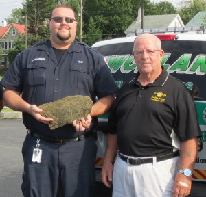 Uwchlan Ambulance Corps Member Jim Werner and Ed Toner display the shale from the Flight 93 crash site that will be memorialized at the Chester County Public Safety Training Center in South Coatesville.