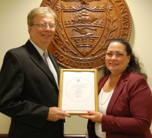 Chester County Chief Operating Officer Mark Rupsis (left) and Chester County Director of Finance Julie Bookheimer display  the Government Finance Officers Association Distinguished Budget Presentation Award for 2013.