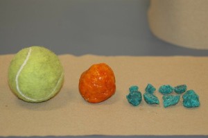 A tennis ball (left) shows the scale of the drug-laced candy found by police.