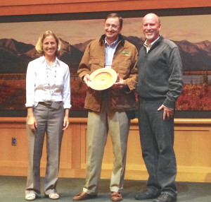 Bern Sweeney (center) receives the 2013 Lifetime Achievement Forest Champion award. Displaying a handcrafted, wooden bowl with the engraving “Chesapeake Forest Champion 2013,” Sweeney is joined by Al Todd (right), the Alliance for the Chesapeake Bay’s executive director, and the U.S. Forest Service’s Chesapeake Liaison, Sally Claggett.Photo courtesy of Alliance for the Chesapeake Bay