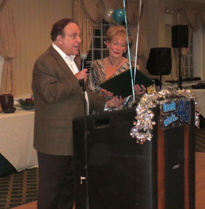 State Sen. Andy Dinniman reads from a certificate honoring the Crime Victims' Center that he presented to Peggy Gusz, its  executive director.