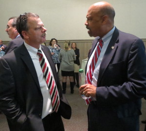 Chester County Commissioner Terence Farrell (right) discusses the Decades to Doorways initiative, with its administrator, Michael Hackman.