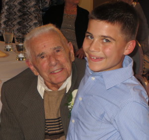 Mike DiPietro poses with 9-year-old Michael Fragale Jr., the son of DiPietro’s barber.