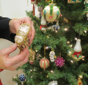 Chester County Sheriff Carolyn "Bunny" Welsh shows the intricate detail on the bottom of one of the newly acquired Christmas ornaments. 