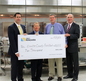 First Niagra’s Allan Burkley (from left) poses with Robert MacNeil, board chairman of the Chester County Food Bank; Larry Welsch, its executive director; and Bob Kane, First Niagara’s eastern Pennsylvania regional president.