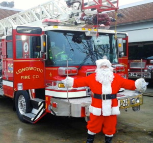 Santa Claus is making pre-Christmas visits throughout the area, courtesy of a Longwood Fire Company truck.