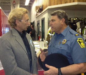 Andy Rumford (left) chats with Kennett Square Police Chief Edward Zunino after one of the community meetings he has hosted in the area to raise awareness about the dangers of heroin. 