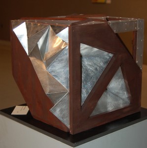 “MAX,” a sculpture created with wood and aluminum by Steffie Mongar, is one of the architecture-inspired works on display this month at the Chester County Art Association.