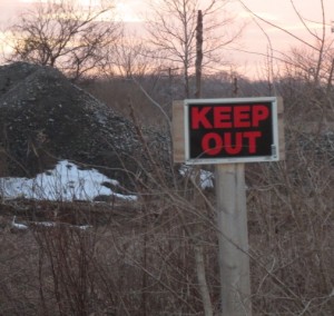 The sign doesn’t deter the homeless from setting up encampments in areas that are difficult to access but offer some protection from the elements.