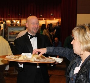 The smiling, tuxedoed wait is Unionville Supt. John Sanville, who served 