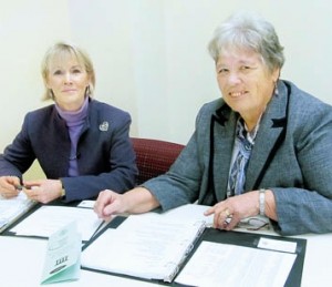 Diane P. Mulhearn (left), the Volunteer Guardianship Program coordinator, and Nancy Breuer, Assistant Orphans’ Court Administrator, review files for the program.