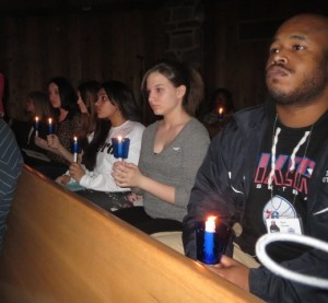 Participants in the 23rd Annual Candlelight Vigil and Memorial Service listen as the names of the county’s homicide victims are read aloud.