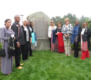 Descendants of the Lenape Indians, including Chief Dennis Coker (second from left), pose in front of the Indian Hannah memorial.