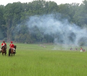 During the height of the battle, a haze of musket fire fills the air.