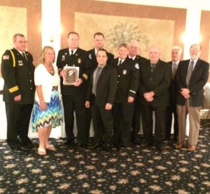 Members of the Southern Chester County Emergency Medical Services – Medic 94 pose with the award they received for distinguished service.