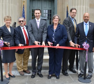 District Judge Gwenn Knapp (from left), Tony Polito from West Chester Men’s Service Club, Commissioner Ryan Costello, Commissioner Kathi Cozzone, Chester County Court President Judge James P. MacElree II and Commissioner Terence Farrell assemble for the ribbon-cutting at the historic courthouse.