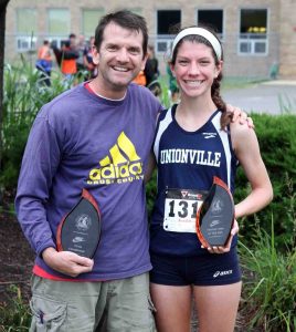 Unionville's Kacie Breeding and coach Mark Lacianca (file photo, courtesy milesplit.com) head into this week's District One track meet at Coatesville with high hopes after winning the Ches-Mont League meet last week.