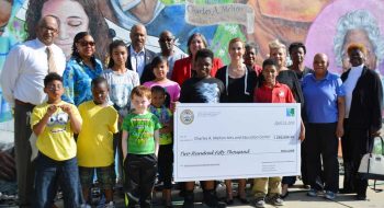 Staff, board members and students taking part in programs at the Melton Arts and Education Center in West Chester, accepting a check for $250,000 from the Chester County Commissioners. The funds will be used for many improvements to the facility.