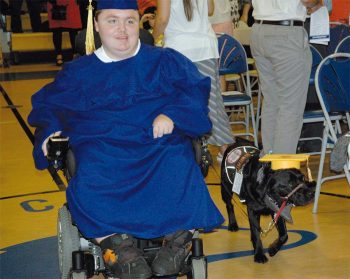 CCDC graduate Cody and his dog Claire walk in the commencement on June 8.