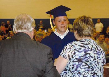 Chase, a CCDC student, receives his diploma from Bonnie J. Wolff, president of the Chester County Intermediate Unit Board, and Dr. Joseph J. O’Brien, CCIU executive director.