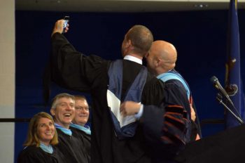 Unionville Chadds Ford Superintendent of Schools John Sanville and Unionville High School Principal James Conley take a 'selfie' during a brief tech glitch in the ceremony.