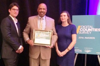 Chester County Commissioners’ Chair Terence Farrell (center) receives the Digital Counties Survey award from (left) Tim Woodbury, Director of Government Relations for Accela and (right) Katie Burke, Government Program Specialist for Laserfiche.