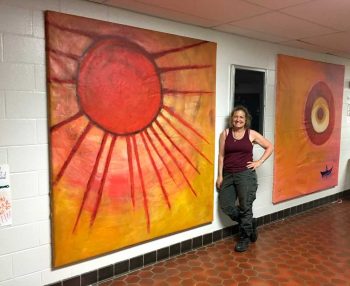 Lele and her sun mural at Charles F. Patton Middle School in Unionville.