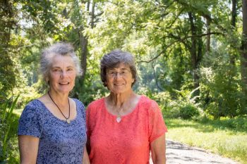 Sisters Patricia Kraus Holt and Kathryn K. McClure on the property they helped preserve as open space.