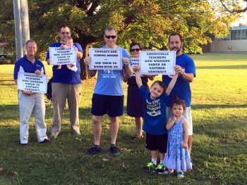 Coatesville Area School District teachers picket Thursday night at South Brandywine Middle School to protest working without a contract.