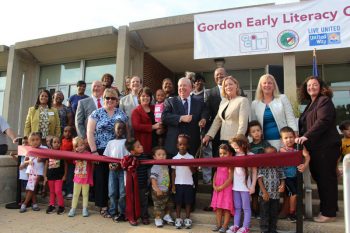 The Gordon Early Literacy Center celebrates its grand opening with a ribbon cutting ceremony.