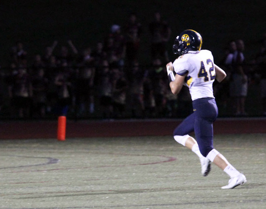 Unionville's James Watson is all alone after grabbing a fumble and racing 50 yards for a score. Jim Gill photo.